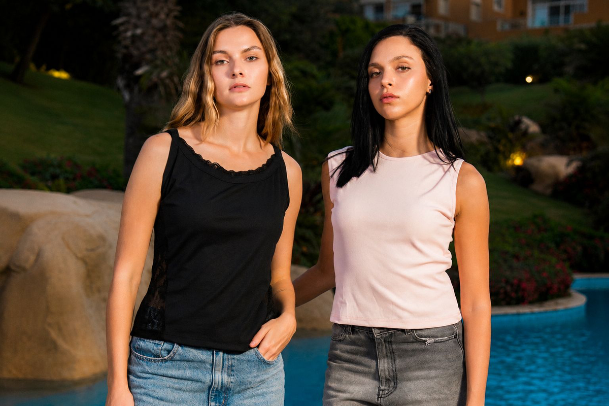 Models wearing the Claro SOLA Lace Trim Rib Tank in black and SOLA Essential Rib Tank in baby pink